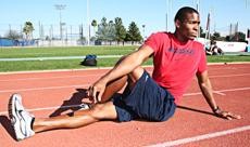 Arizona senior Bobby McCoy stretches before a run at Drachman Stadium, Tuesday. McCoy came to the UA as a football and track star, but after walking away from the football squad, he is one the top sprinters in the country.