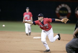 Wildcat second baseman Colt Sedbrook flips the ball toward first base to record the first out of the ninth inning in Arizonas 3-2 win last night over San Diego State at Sancet Stadium. Arizona co-closer Jason Stoffel then struck out the remaining two Aztec batters to preserve the Wildcat win.