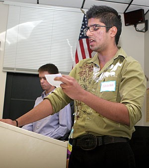 Krishna Israni, a pre-physiology freshman, argues yesterday that amnesty is the solution to U.S. immigration issues in the Modern Languages building. The conference, Doing Democracy was put on by English 102 classes and continues through today.