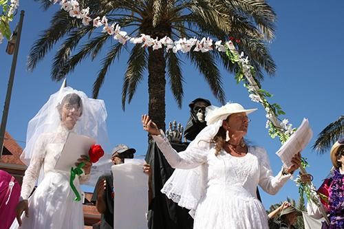 Mary DeCamp and Doctress Neutopia, along with the other Raging Grannies, performed a mock wedding Monday on the mall. The ceremony was presided over by the grim reaper as the women mocked getting married to Raytheon.