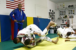 Demetrius Ramos, far left, is a national champion and owner of Tucson Brazilian Jiu-Jitsu Academy. Ramos prepares himself and a team of fighters from the UA and Pima Community College for the World Championship this weekend.