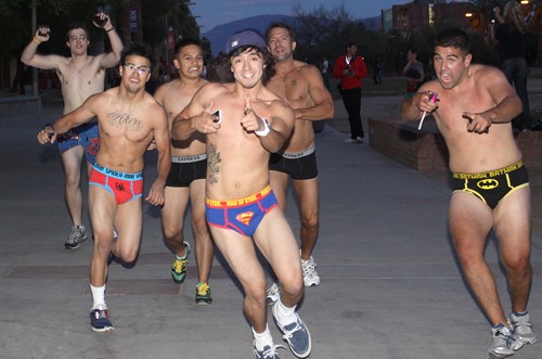 Ernie Somoza / Arizona Daily Wildcat 

Students run around the UA Mall for the first annual Zona Zoo Undie Run where students come wearing clothes they plan to donate so that they can bare down before joining the run.
