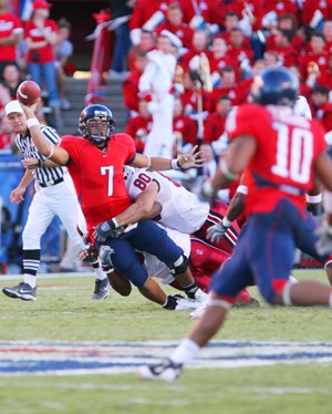 Arizona quarterback Willie Tuitama (7) gets hit as he throws in a 21-20 Wildcat loss to the Cardinal last year at Arizona Stadium. Tuitama is 284 yards away from becoming Arizonas all-time leading passer as the Wildcats take on Stanford on Saturday.