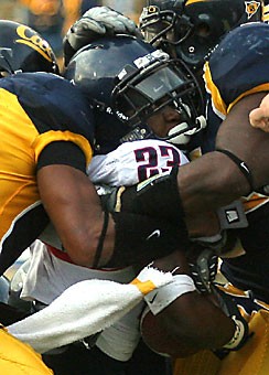 Freshman running back Nicolas Grigsby gets sandwiched between two California defenders in Arizonas 45-27 loss Sept. 22 at California Memorial Stadium. Grigsby had a breakthrough performance the following week against Washington State.
