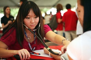 Tina Phan, a second year pharmacy student, checks the blood pressure of Amy Nguyen, a pre-pharmacy sophomore, during Pharmacy Day on the UA Mall on Thursday.
