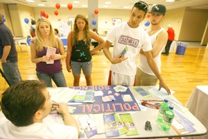 From left to right, undeclared sophomores Kendall Meisler, Melissa Knowski, and undeclared freshmen Dominic Matteucci and Daniel Kidwell listen to Michael Greeley, an academic adviser for the Political Science Department at the Meet Your Major fair in the Student Union Memorial Center on Wednesday.