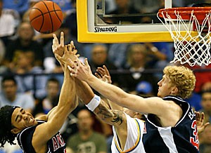 Arizona guard Daniel Dillon and forward Chase Budinger, right, try to grab a rebound from UCLA center Lorenzo Mata during the second half of then-No. 11 Arizonas 73-69 loss at No. 3 UCLA Saturday in Pauley Pavilion, the Wildcats fourth defeat in their past five games. During that stretch Budinger said Arizona hasnt played with the same attitude it had during its preceding 12-game winning streak.