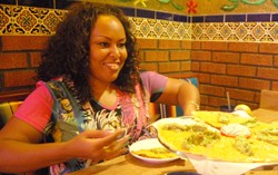 Scottsdale resident Denise Mitchell enjoys an entrǸe from the Mi Nidito Mexican  restaurant. Mitchell says that her favorite dish are the shredded beef flautas.