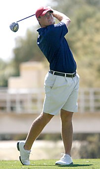 Arizona senior Brian Prouty finishes his swing on the sixth hole in the second round of National Invitational Tournament yesterday at Omni Tucson National Golf Course. Prouty is currently tied with teammate Nathan Tyler for fourth place, while the team is tied for fifth.