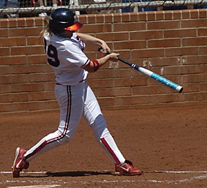  Senior shortstop Kristie Fox belts a home run in a 9-1 win over Oregon yesterday at Hillenbrand Stadium. Fox hit two home runs and collected seven RBIs in three wins for the No. 3 UA softball team this weekend. 