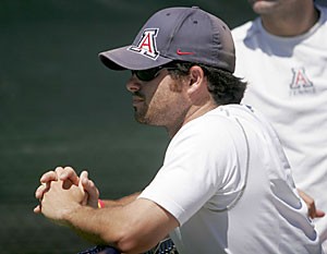 UA tennis assistant coach Tom Lloyd watches his squad March 31 in a match it lost to Berkeley at Robson Tennis Center. Lloyd, also a former UA player, spent time as ATP Tour pro Taylor Dents coach.