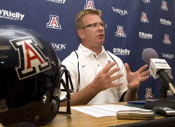 Arizona football head coach Mike Stoops addresses the media in McKale Center on Sunday. The Wildcats began fall camp Monday.