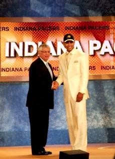 UA freshman Jerryd Bayless is greeted by NBA commissioner David Stern on the stage at Madison Square Garden on Thursday night during the NBA Draft. Bayless was chosen as the 11th overall pick by Indiana but was later traded to Portland.