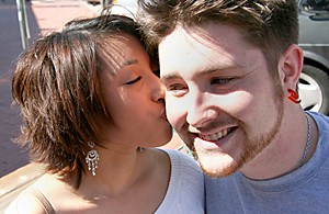 photo illustration by TAYLOR HOUSE / Arizona Daily Wildcat

Psychology junior Anna Maria DaMommio kisses her boyfriend music sophomore Evan Casler on University Blvd. How couples celebrate the 14th at the UA is varied---some spend the holiday with a significant other while others choose to ignore Valentines Day completely.