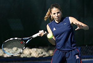 Arizona junior Camelia Todorova rears to hit during the No. 36 Wildcats 6-1 win over No. 73 Cornell yesterday. Todorova teamed with sophomore Danielle Steinberg to win her doubles match and then won her singles match later in the day.