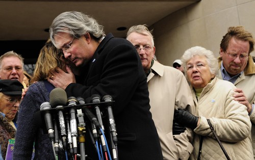 Johanna Chapman, left, hugs her brother, Dr. William Petit, as their family gives a statement to the media outside New Haven Superior Court Monday, November 8, 2010, after jurors found Steven Hayes eligible for the death penalty. (Bettina Hansen/Hartford Courant/MCT)