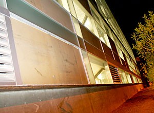 A window on the outside of the Architecture building is boarded up after it was vandalized.  A recent string of crimes have caused $100K in damage.