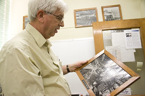 Rebecca Rillos / Arizona Daily Wildcat

David Lynch, professor of mining engineering and material science and engineering, shows a photograph of a mine in Tacoma, Wash., from 1941 **I will text you with double-checked info**. Lynch received a patent last year related to the creation of silicon.