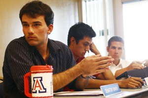 From left, ASUA Senators Bryan Baker, Andre Rubio and Jason Mighdoll discuss UA  Votes during their meeting Wednesday in the Student Union Memorial Center.
