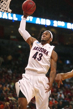 UA forward Jordan Hill executes a trap in the first half of Arizonas 84-71 win Friday night in AmericanAirlines Arena in Miami. The Wildcats won the first round of the NCAA Tournament primarily due to aggressive defensive traps.