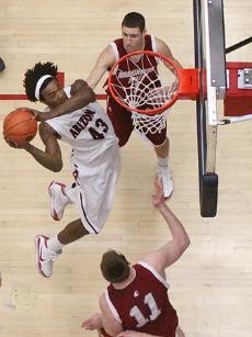UA forward Jordan Hill locks in for the dunk during Arizonas 66-56 win over Washington State Saturday in McKale Center. Hill scored 16 points and grabbed 16 rebounds, giving the Wildcats a weekend sweep over the Washington schools.