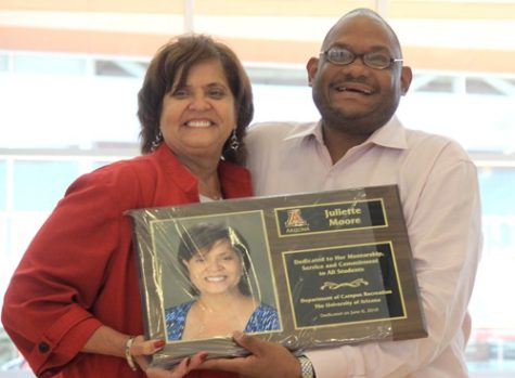 Will Ferguson/ Arizona Daily Wildcat 

Mirum Washington White presents Campus Recreation Director Juliette Moore with a life time achievement plaque to be placed in the newly completed campus recreation center. The photo was taken on 6/8/10.