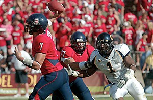 Sophomore quarterback Willie Tuitama prepares to air it out in Arizonas 24-20 win over California Nov. 11 at Arizona Stadium. Tuitama threw for 120 yards in the first half of Saturdays win at Oregon before he was taken out for precautionary reasons, but he should be ready to play Saturday against ASU.