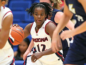 UA senior guard Ashley Whisonant dribbles during a 76-70 exhibition win over Vanguard on Oct. 5 in McKale Center. Whisonant leads the team this season with her tremendous guard play and ability to help new faces adjust. 