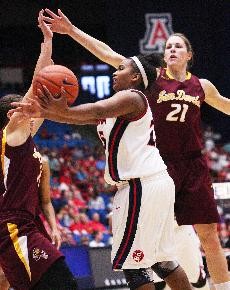 UA guard Reiko Thomas gets pressured by a pair of ASU defenders during a 50-43 Sun Devil Win on Saturday in McKale Center. The Wildcats take on Washington State tonight at 7 to kick off the final weekend of womens basketball in Tucson this season.