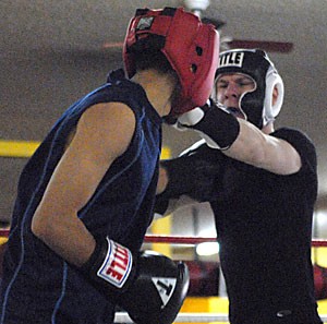 Michael Williams, right, a psychology and political science student at Arizona, works out with sparring partner Francisco Quintero, a student at Pima Community College, for his first exhibition-boxing match on Feb. 17 at Boxing, Inc., 1240 N. Stone Ave.