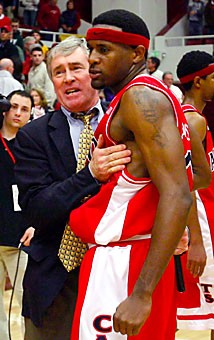 Former UA guard Hassan Adams, right, gets congratulated by former UA associate head coach Jim Rosborough after Arizona beat Stanford 76-72 Feb. 19, 2006 in Stanford, Calif. Rosborough was Arizonas lead scout on the Cardinal for a number of years.