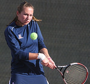 Kasia Jakowlew swings through a backhanded return yesterday during the Wildcats 4-3 loss to Penn at the Robson Tennis Center. After a two-hour rain delay the match started with singles, where Jakowlew fell to Penns Michelle Mitchell 6-3, 6-3.  