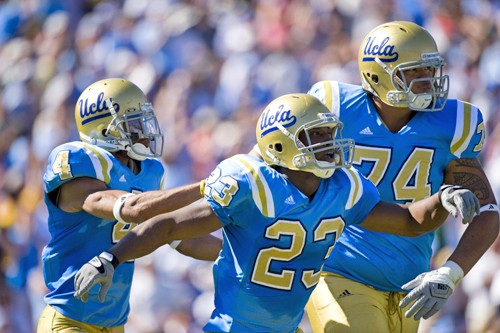 UCLAs Terrence Austin (4), Johnathan Franklin (23), and Stan Hasiak celebrate Franklins 74-yard touchdown in the second quarter, Saturday, October 17, 2009, in Los Angeles, California. (Michael Vasconellos/Orange County Register/MCT)