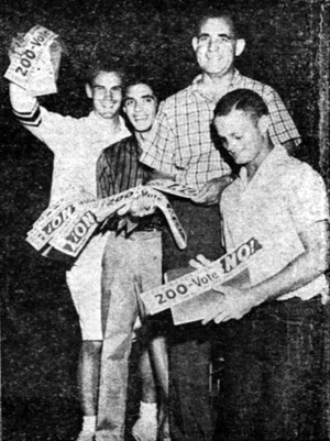 Descending from the stage after their part in a joint football-Vote No 200 campaign pep rally held Sept. 25, 1958, supporters give their final cheer. From left, they are Dan Mariscal, Dan Membrila, UA Alumni Association director Swede Johnson and Ralph Hunsaker. 