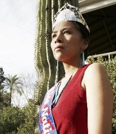 Miss Native American University of Arizona pageant winner, Candace Begody, a journalism senior, wears her crown and sash while standing outside of Old Main yesterday afternoon.