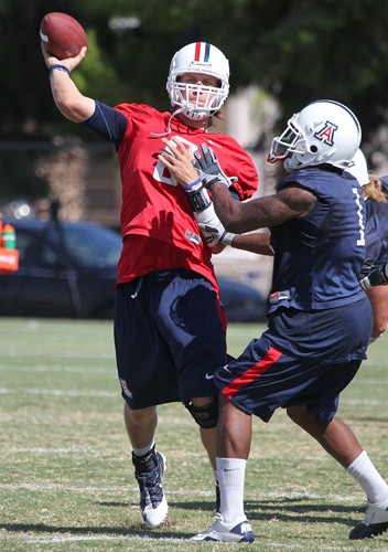 The University of Arizona football team takes part in morning practice Friday, Aug. 20, 2010, at the Rincon Vista Sports Complex in Tucson, Ariz. The Wildcats look to reach a bowl game for the third season in a row with quarterback Nick Foles at the helm.
(Photograph by Mike Christy)