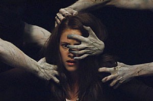 The Messengers Kristen Stewart gets pulled into a haunted basement by a bunch of extras from The Descent. Or thats what they look like, at least.  