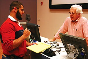 Professor Charles Putnam answers a students question about his molecular and cellular biology lecture yesterday afternoon. Putnams latest test was nullified because of controversy over a fraudulent e-mail that stated the exam was canceled, which resulted in 18 students not showing up to take the test.