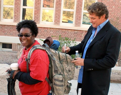 Lisa Beth Earle/ Arizona Daily Wildcat

Traci Smith, a freshman majoring in computer science and religion, gets her backpack signed by David Hasselhoff when he came to campus on Wednesday, Feb. 17. Smith recently returned from a one year deployment as part of the Army National Guard in Afghanistan and was excited to meet the celebrity.