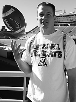 Walk-on quarterback Jimmy Bevell spins a football on his hand as he stands outside Arizona Stadium. The 21-year freshman from Scottsdale returned from a Mormon mission to Argentina and found a spot on Arizonas football team.