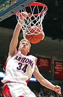 Freshman forward Chase Budinger flies in for a dunk in the first half of No. 15 Arizonas 101-79 win over NAU last night in McKale Center. Budinger scored 23 of his game-high 32 points in the first half.