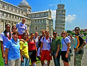 The Arizona womens basketball team poses in Pisa near the Leaning Tower on May 21. During their two weeks in Italy, the Wildcats toured some of Italys most popular and historic destinations and went 5-0 against selected FIBA teams. (Julian Temblador/Arizona Athletics)