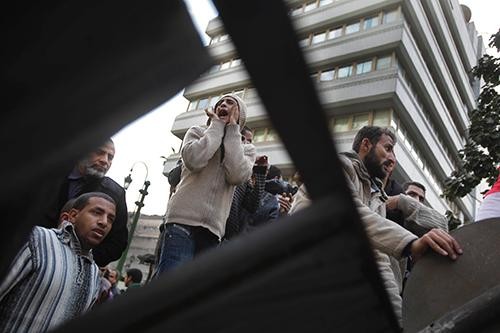 A group of protesters established themselves in front of the Egyptian Parliament building, Wednesday, February 9, 2011, in Cairo, Egypt. 