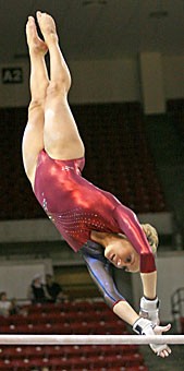Junior Karin Wurm performs on the bars at the Pacific 10 Conference Championships in Wells Fargo Arena in Tempe. Wurm finished second on bars and sixth all-around as the Wildcats took fourth place.