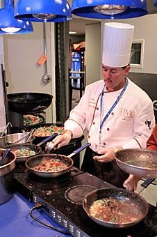 Mario Diaz-De Sandy, executive chef at the University Medical Center cafeteria, prepares lunch for a long line of hungry hospital workers and patients. Chef Diaz-De Sandy is currently applying to appear on the TV show Hells Kitchen.