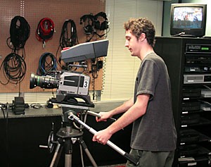 Media arts senior Brewster Keith, general manager of UATV-3, prepares to bring in new equipment after accepting a sizeable grant. 