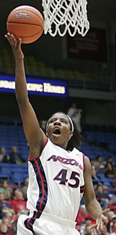Guard Joy Hollingsworth goes up for a layup in Arizonas 83-41 win over Nicholls State last night in McKale Center. Hollingsworth recorded the second-most points (12) and rebounds (eight) for Arizona.