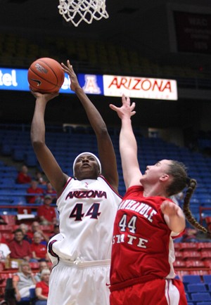 Arizona center Beatrice Bofia, left, lunges toward the hoop in a 85-33 exhibition win over Oklahoma Panhandle in McKale Center on Nov. 4. Arizona plays its first home game of the season Sunday at 3 p.m. against UC-Santa Barbara.