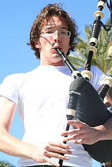 Philosophy junior Matt Campbell plays the bagpipes with the UA Scottish Club at yesterdays World Fair on the UA Mall.