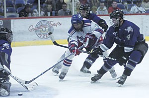 Icecats forward Robbie Nowinski tries to score in the third period of Arizonas 4-3 overtime win against Weber State on Saturday at the Tucson Convention Center. The Icecats split the weekend series.